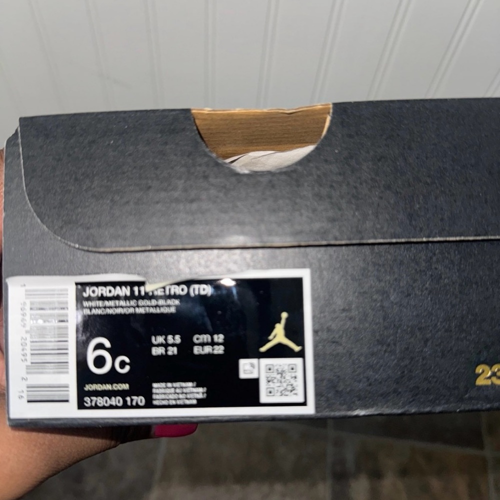 Jordan 11 Retro TD in Black and Gold